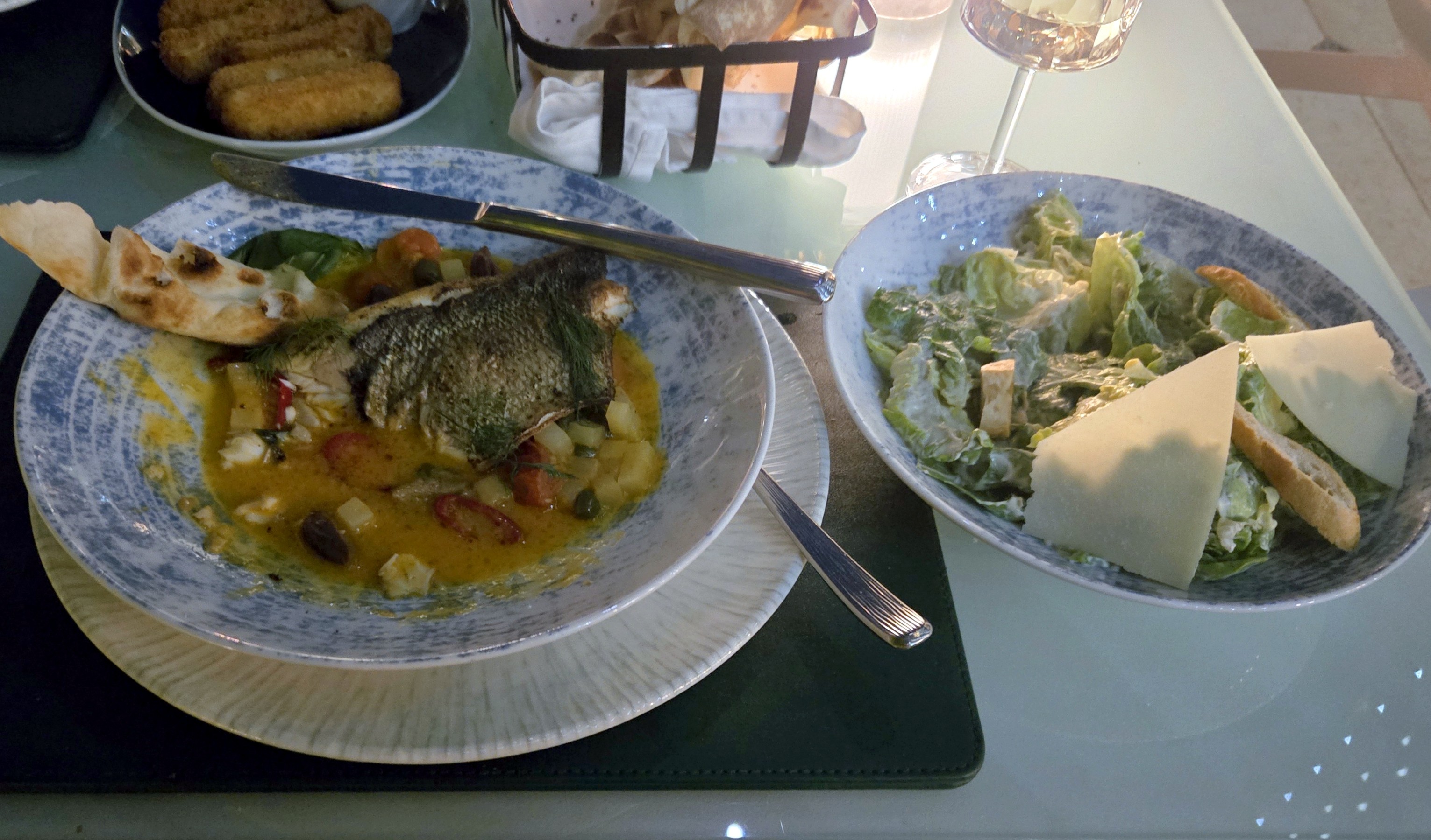 Dinner by the pool was an excellent sea bass in a veggie stew and a delightful Ceasar salad.