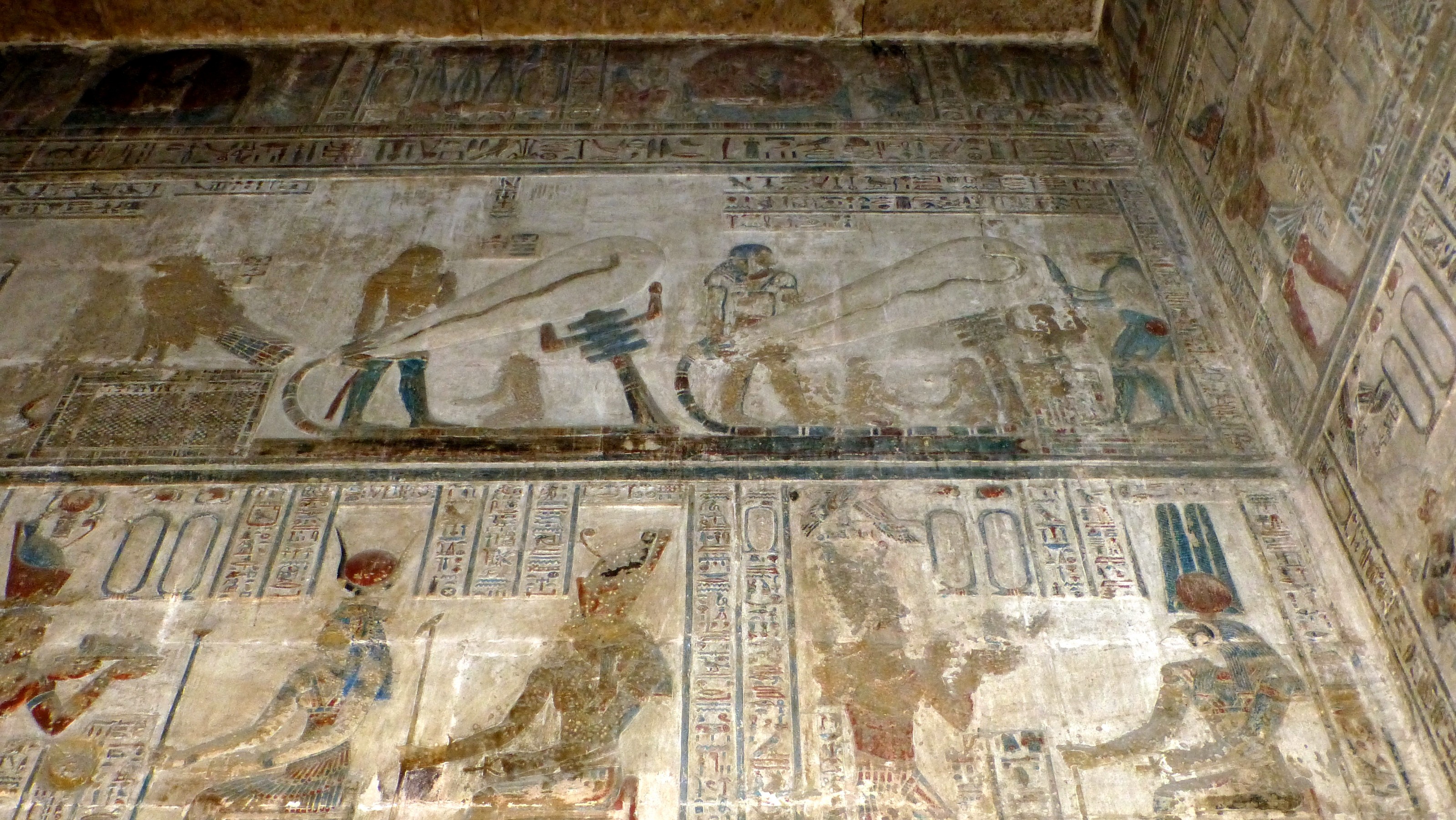 Here are depicted two workers holding what appears to be <q>Edison bulbs</q> connected to something that might be a power source. Or so the Ancient Alien theorists would have us believe. In truth this is a lotus plant, vines and a snake, powerful symbols to the Egyptians.