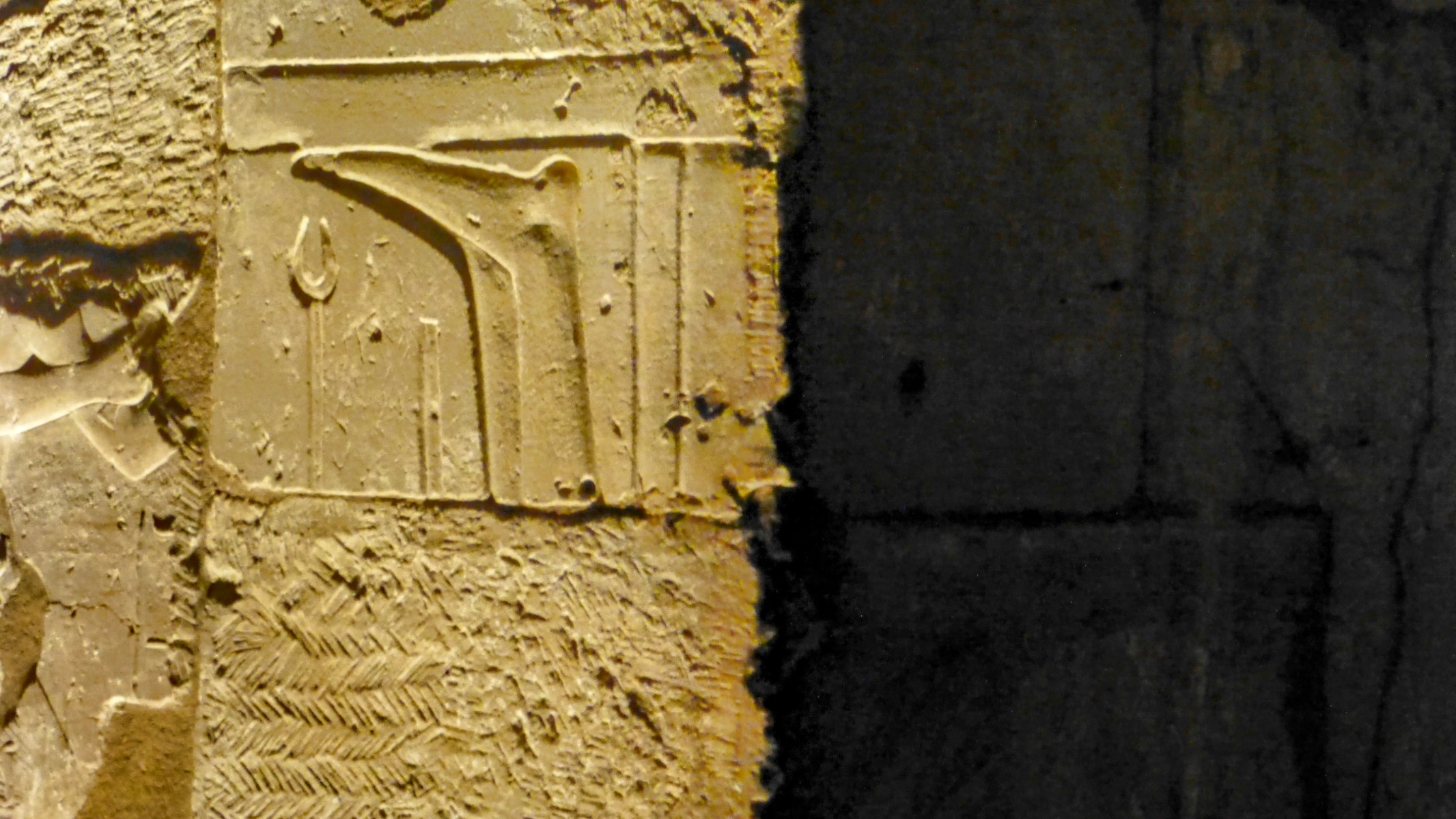 Parts of Luxor was built with stone salvaged from other temples. Here a stone containing some feet was used without regard to proper orientation.