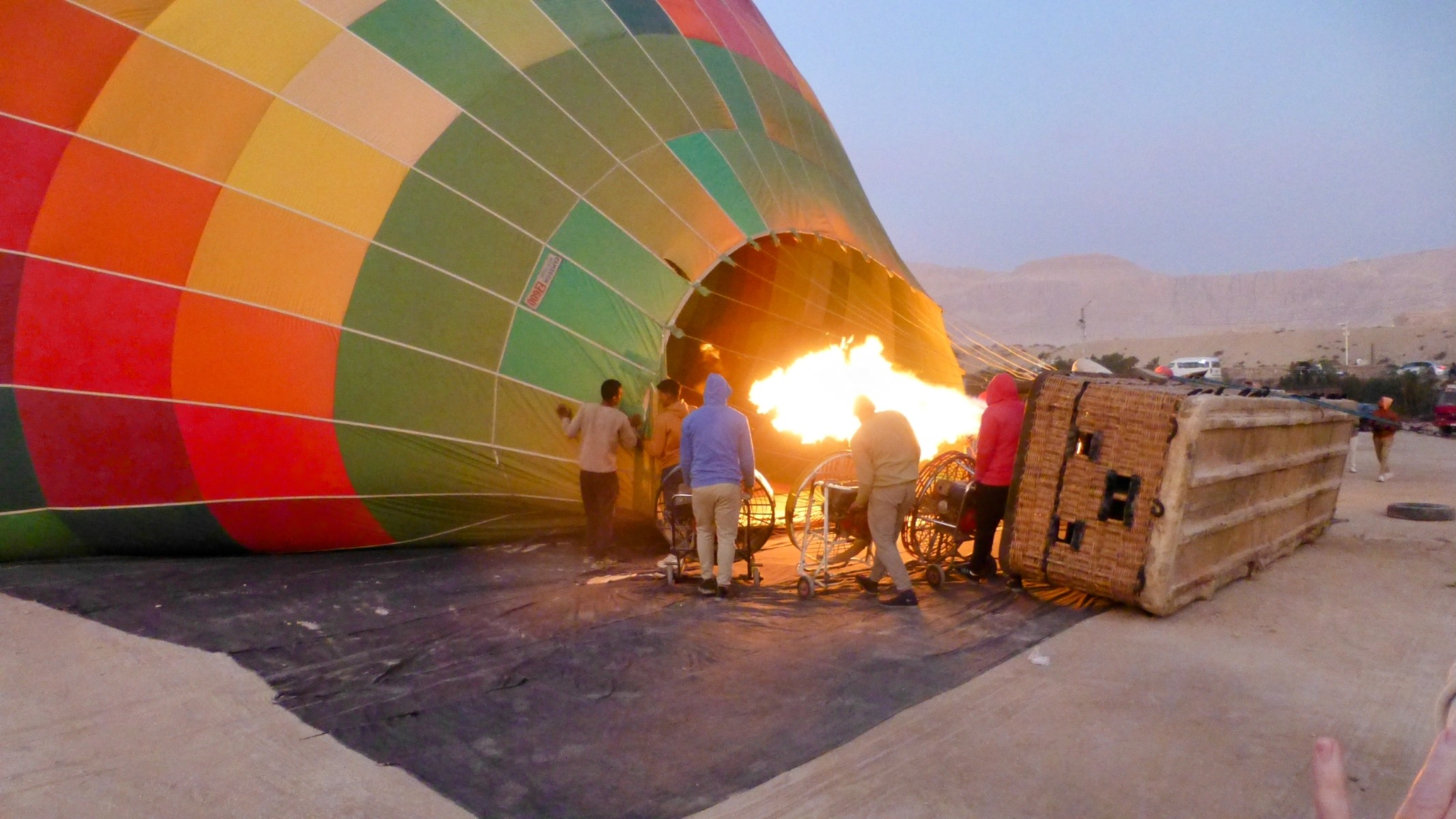 Inflating our hot air steed to ride the skies.