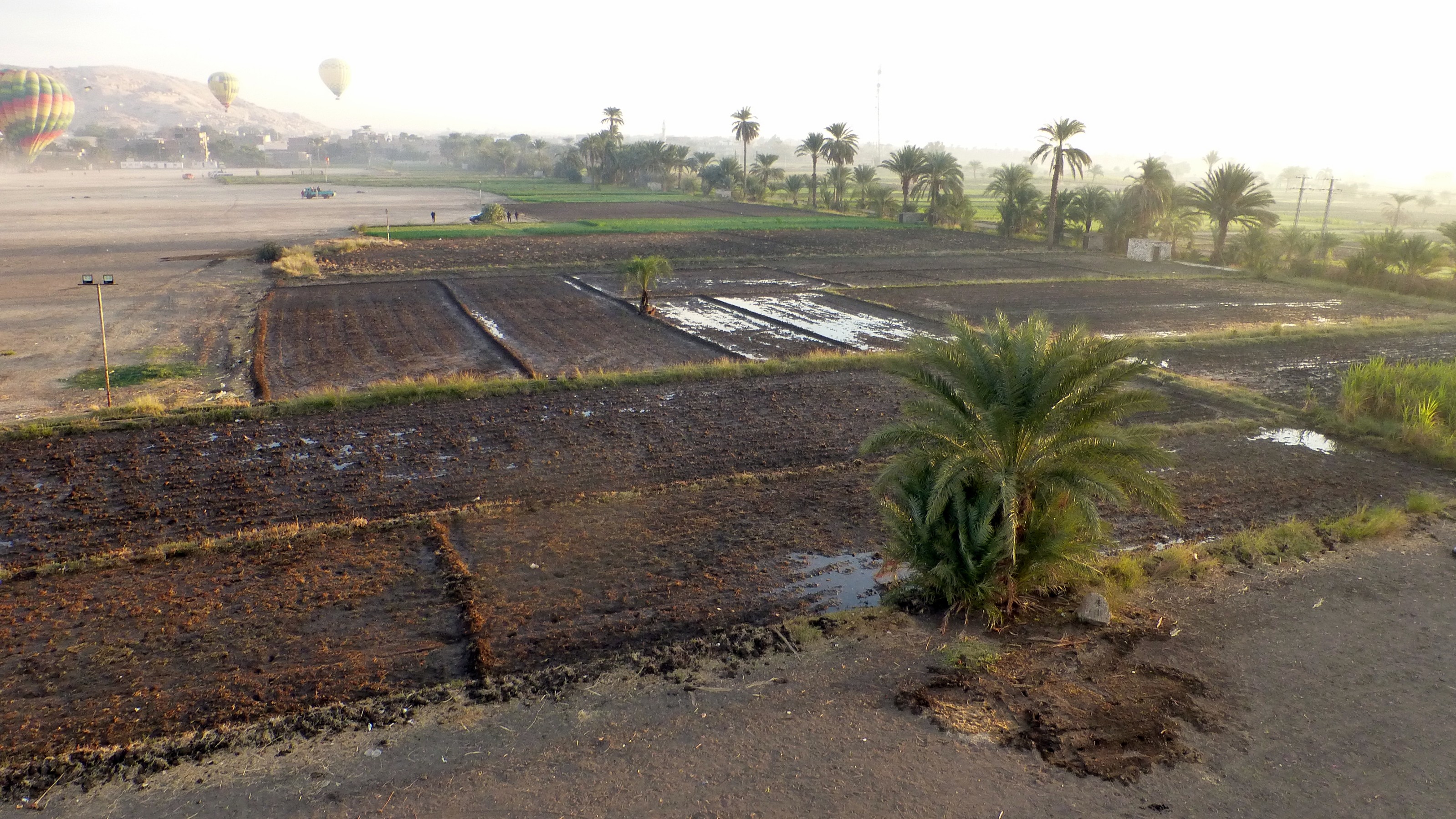 We were headed to land in this muddy field. Fortunately the crew arrived and, with some heavy rope tugging and hot air lift assist we manage to set down on dry land. However, the crew's shoes were caked with mud.