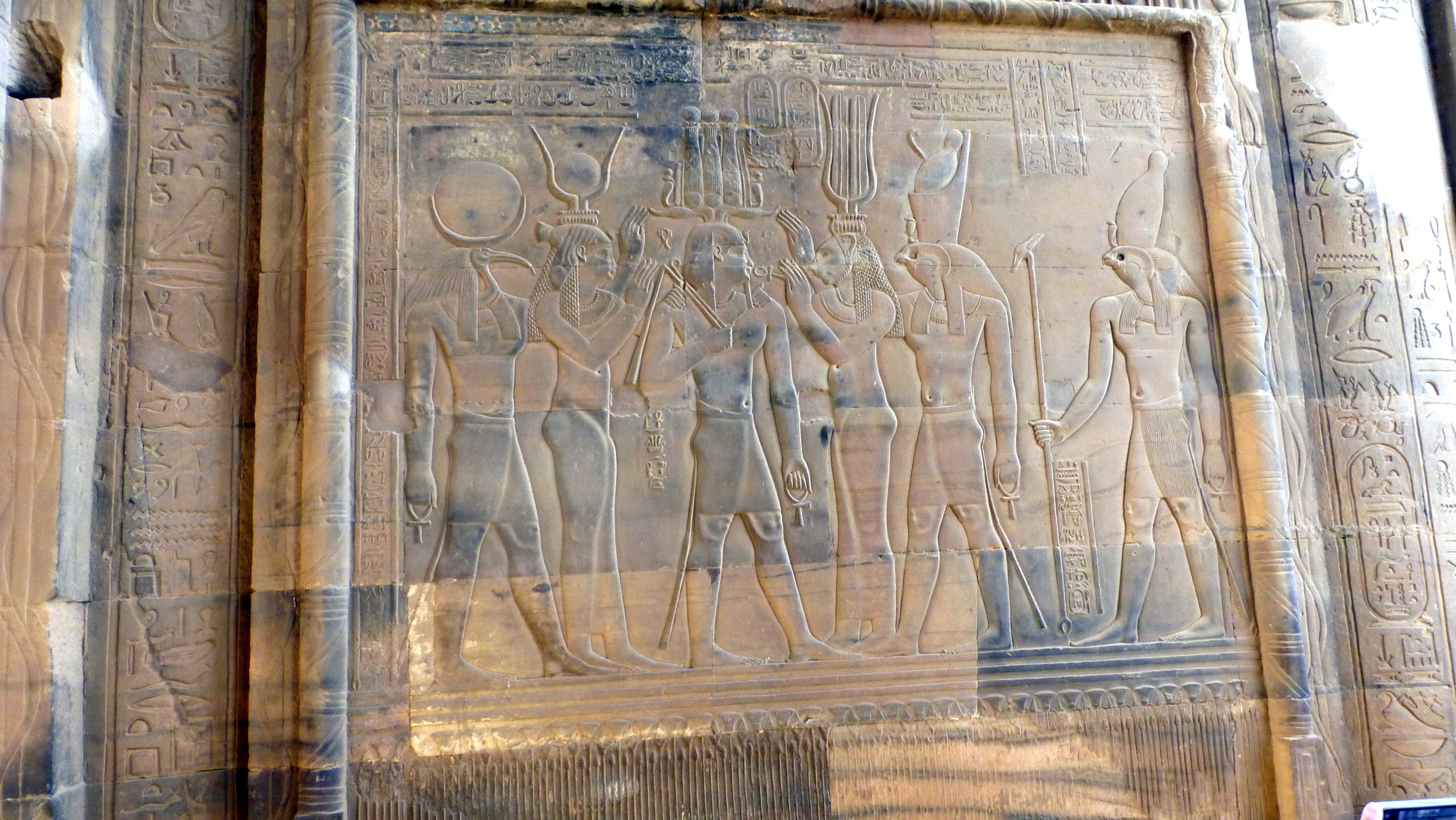 Left to right, Toth, Hathor, Ptolemy VII, Sekmet, Horus with the crown of Upper and Lower Egypt and Horus depicted with the crown of Upper Egypt.