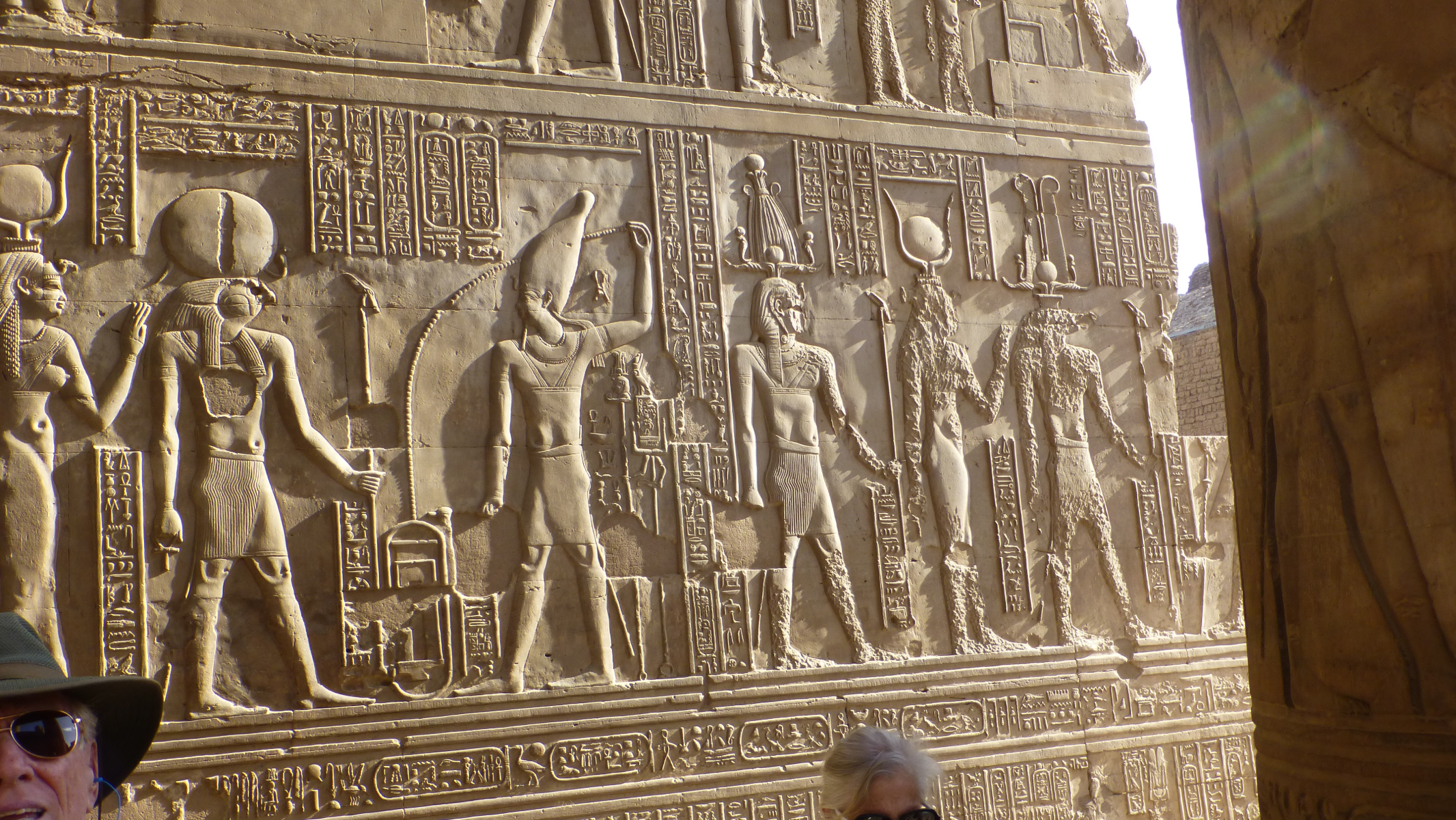Note the two figures on the right that have had parts of their bodies pecked away. This was done by any of a number of religious orders, including Christians, that had taken over the temple as a church. The pecking of the figures was to remove them; however, only a portion of the figure or figures had to be pecked.