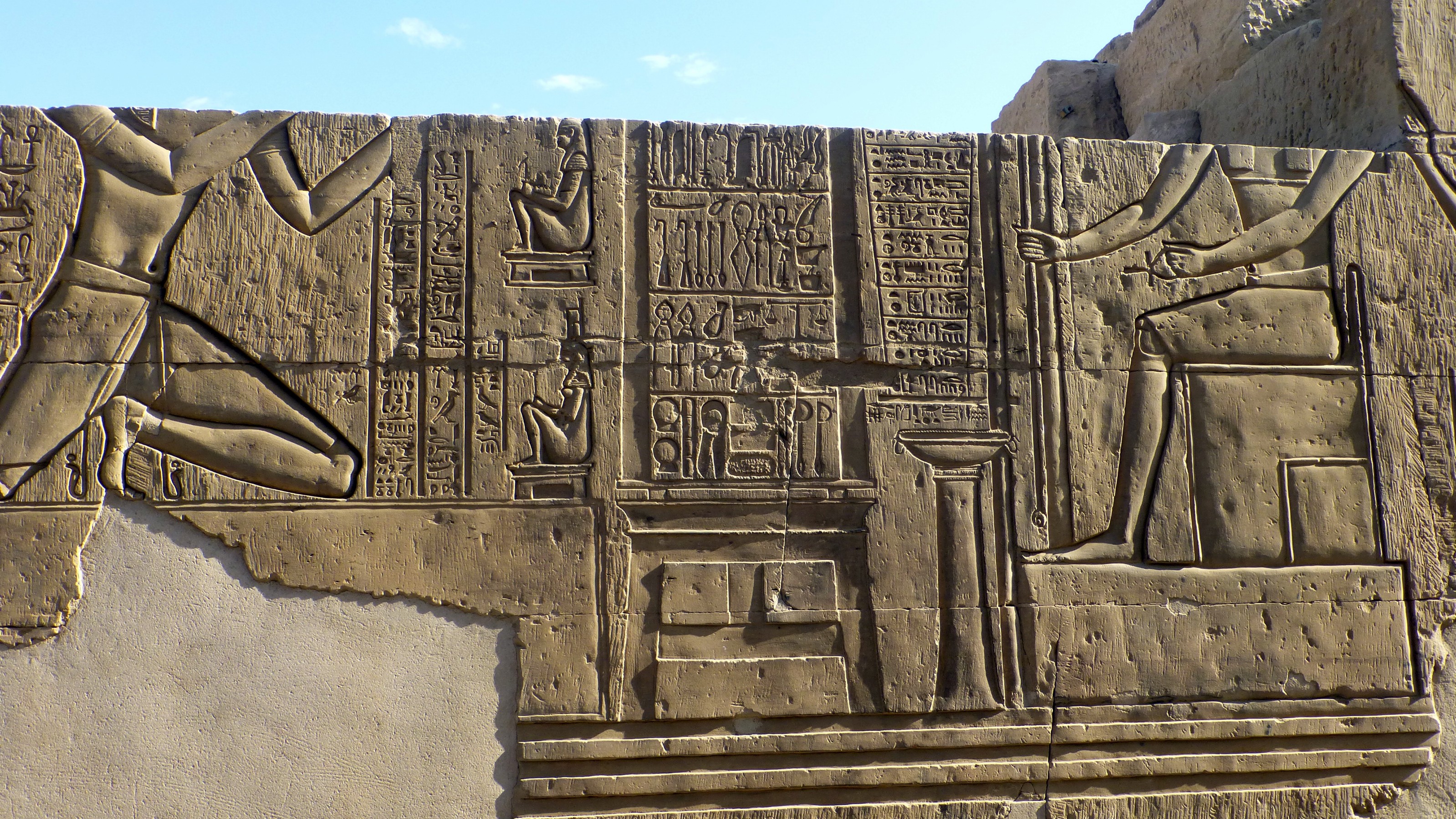 Among its other duties, Kom Ombo provided medical assistance. The figures in the middle show a number of medical instruments including scalpels, forceps, curettes, specula, scissors, saws, and medicine bottles. To the right, the hieroglyphs explain how each instrument is used.