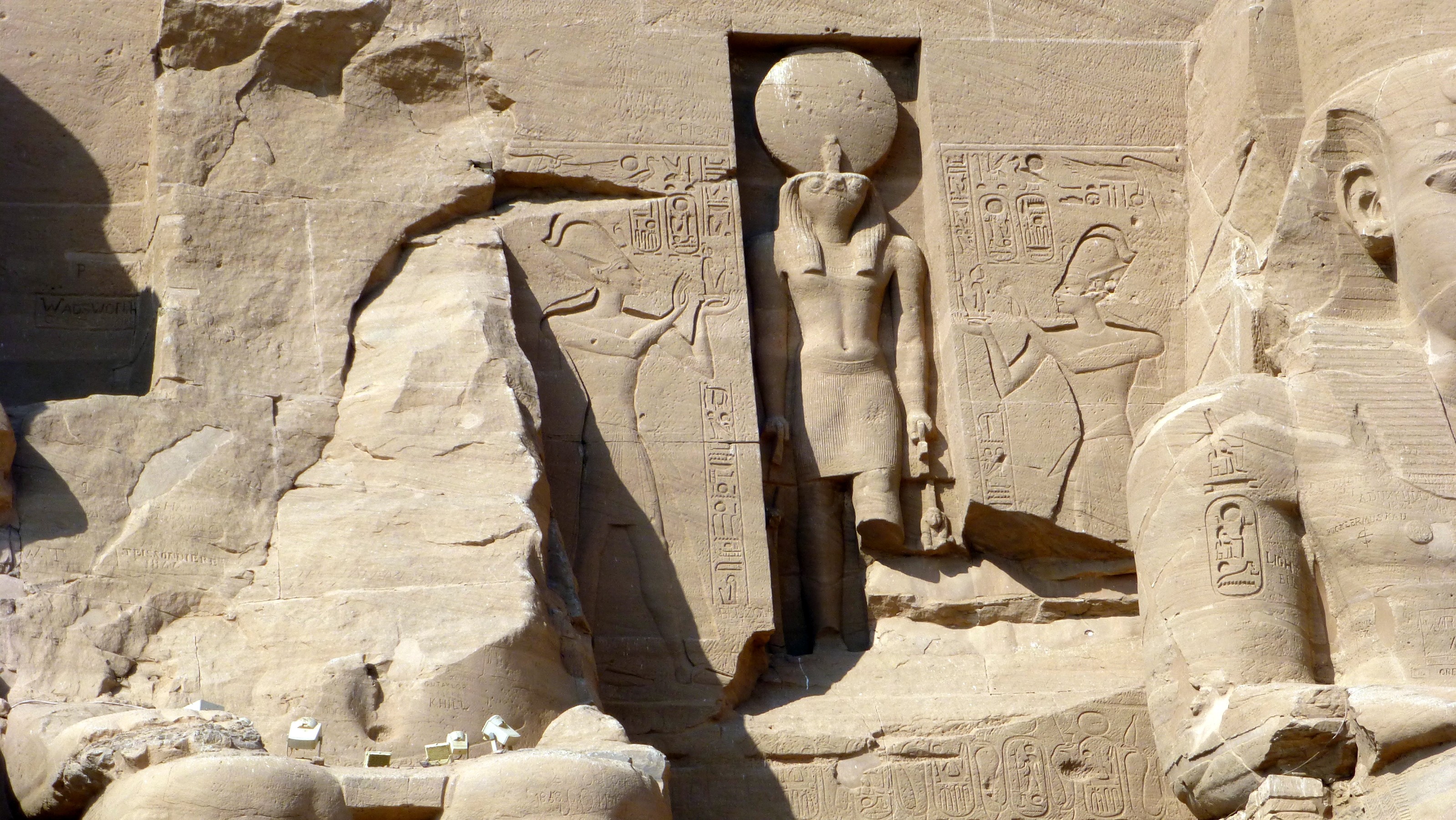 Above the entrance is Horus with the Sun disk above his head.