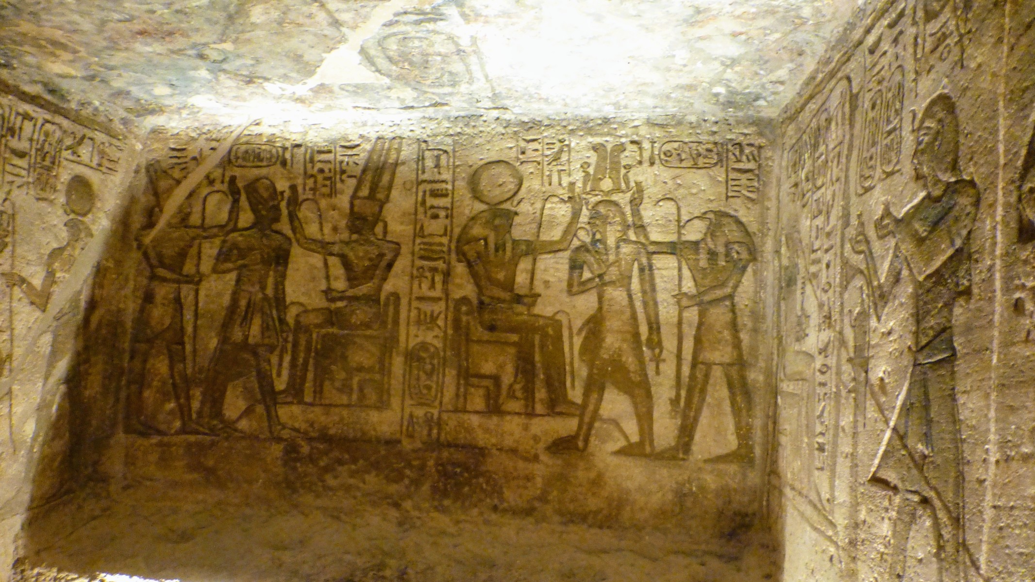 On the left is Ramses II surrounded by two dieties to be identified later. And on the right he is flanked by Horus and Toth.