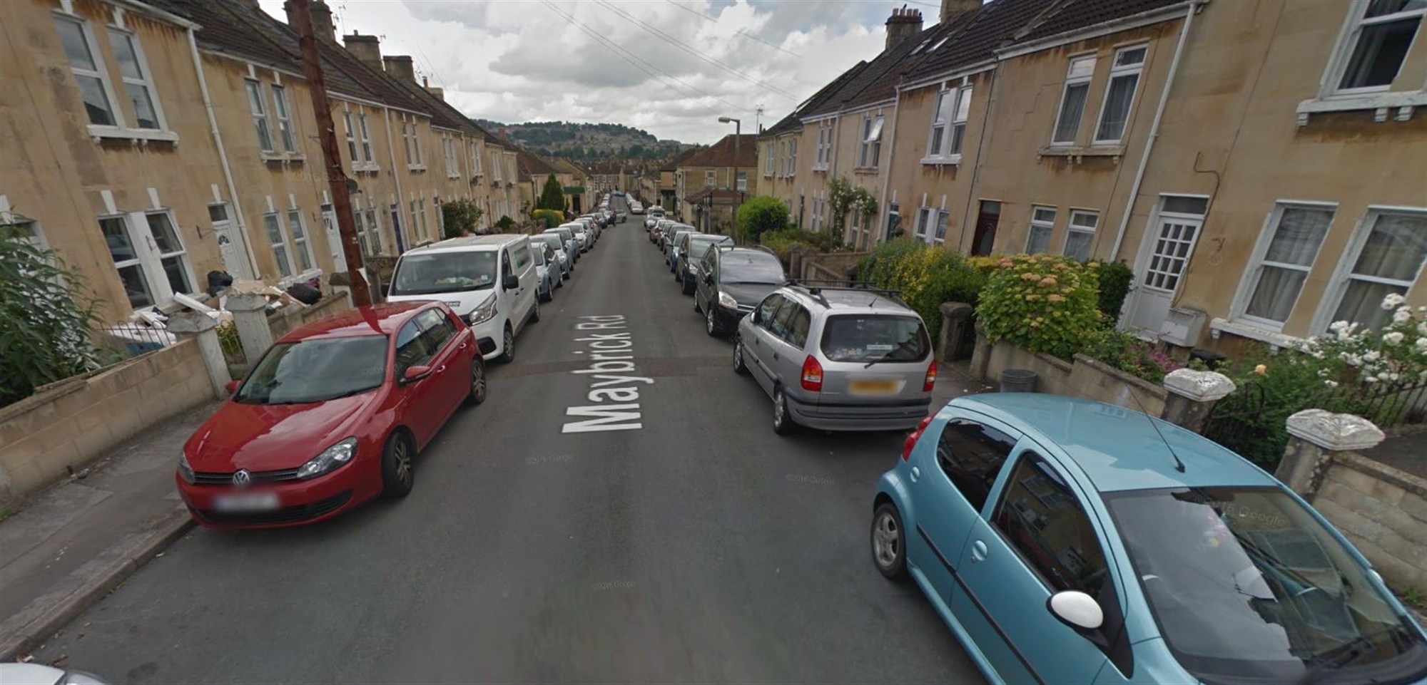 Auto lined residential street in Bath