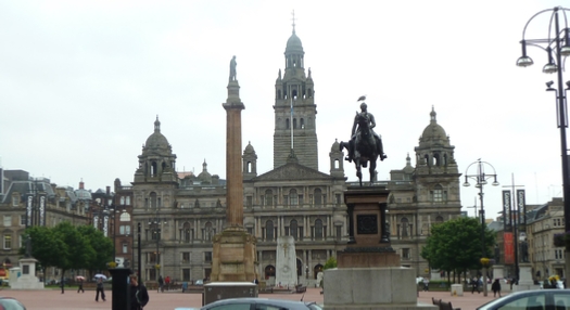 George’s Square in the heart of Glasgow with the tall statue to Sir  Walter Scott