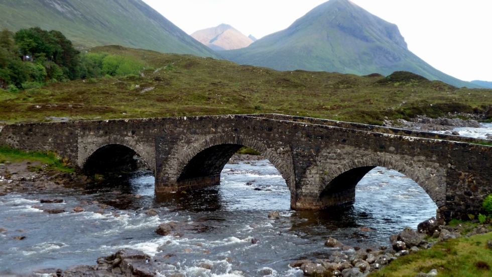 The old bridge over the Sligachan River with the Black Cullin Mountains in the background.