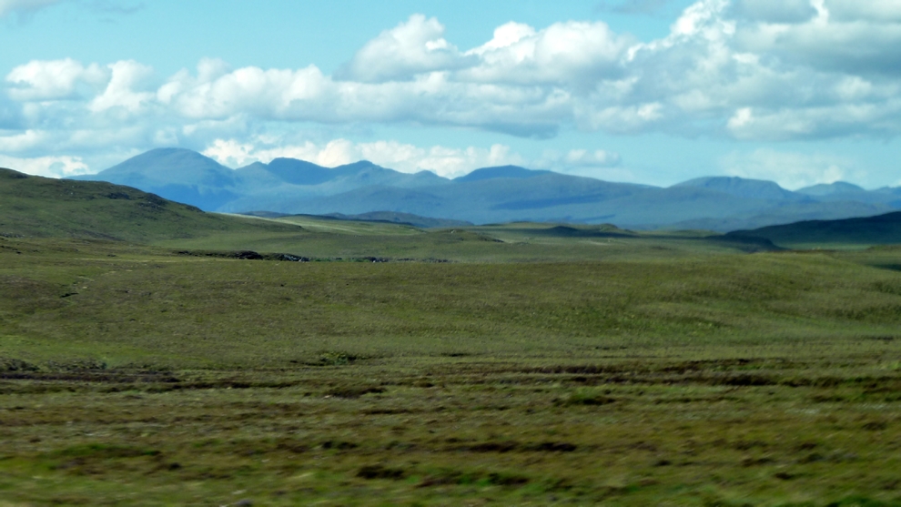 From Lewis looking back to the mountains of Harris. The furrows in the foreground are from cutting peat.
