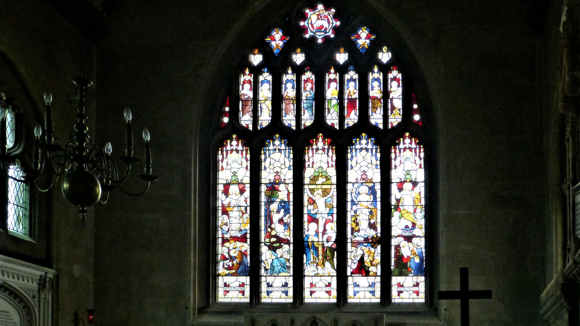 The stained glass window above the Alter