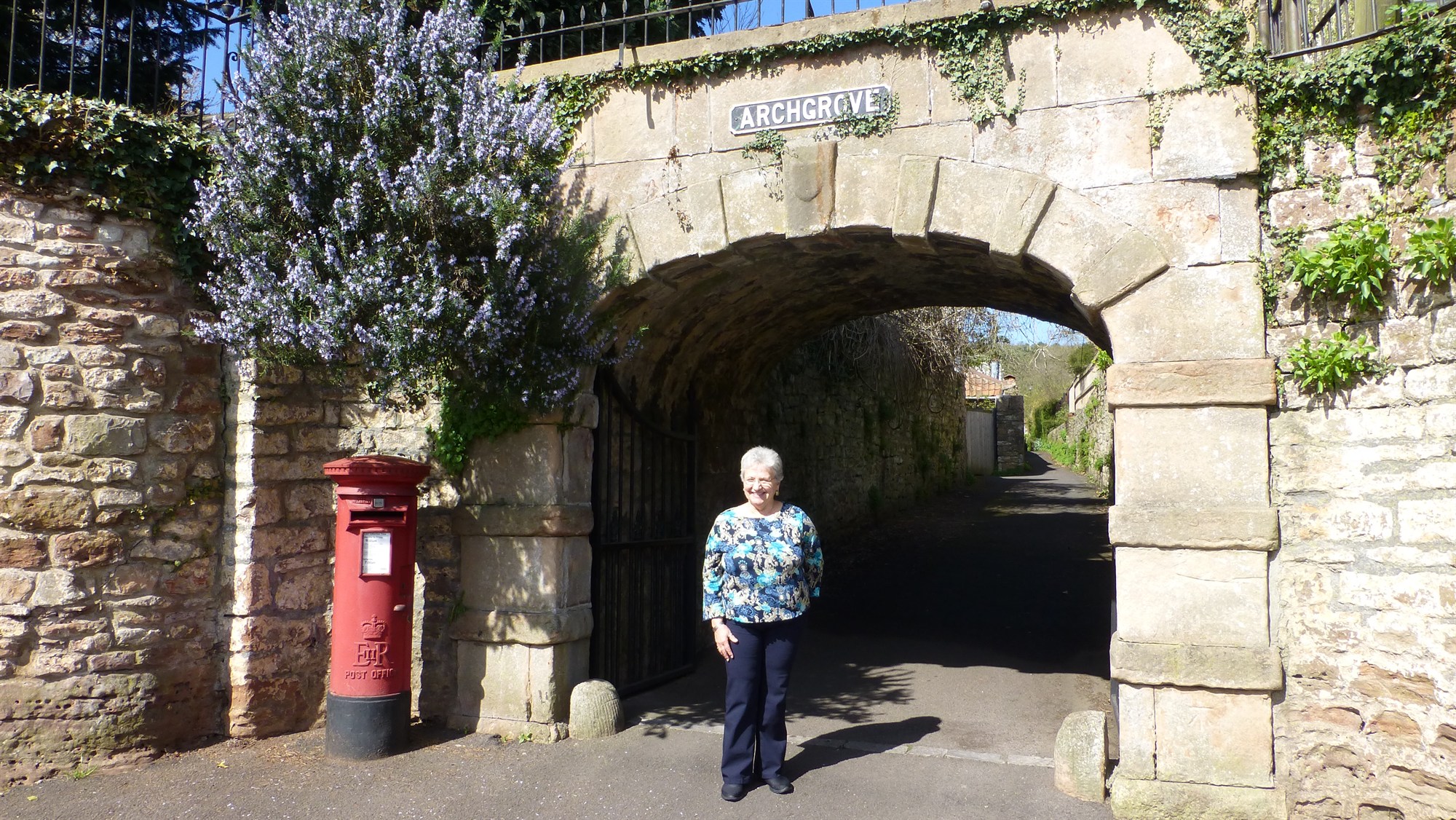 Cissy standing in the entrance to the Archgrove Cottages