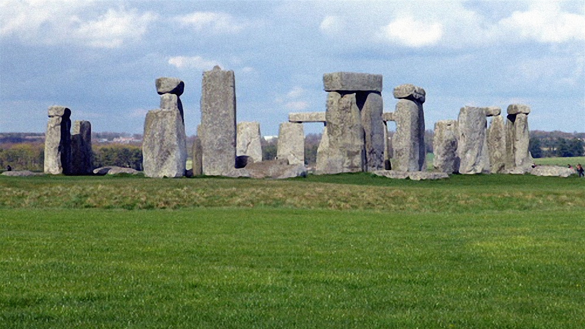 The shallow ditch is visible in front of the Stones