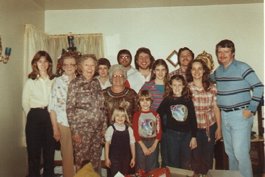 Sue, Aunt Mae, Aunt Francis, Delores, Momma, Frank, John, Glenda, Bennet, Cissy, Me, (front) Tricia, Jeff, and Amy (c. 1981)